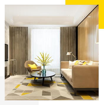Chic living room, yellow accents, geometric rug.